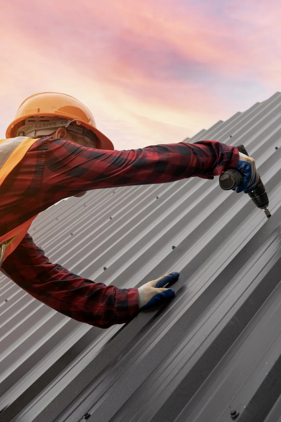 Roofing contractor celebrating a new booked job after receiving a lead on his phone